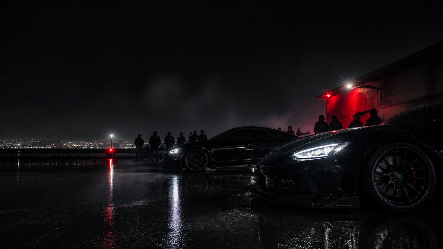 Night car meet with dark performance cars and red light reflections
